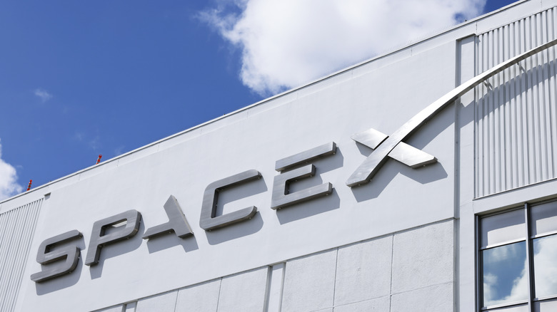 The SpaceX logo in front of its headquarters.